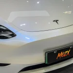 Gloss White Shift Blue PPF Wrap Tesla Model 3 Indoor Light Close-up