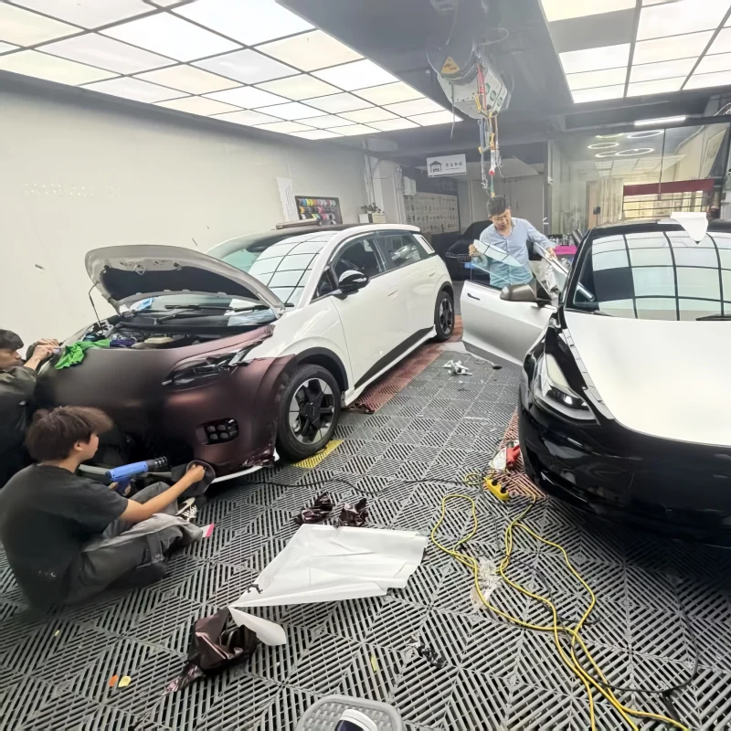 Professional car wrap installation shop finished product, grey SUV with matte metallic wrap