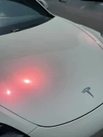 White Iridescent Red PPF Tesla Logo Hood Close-up