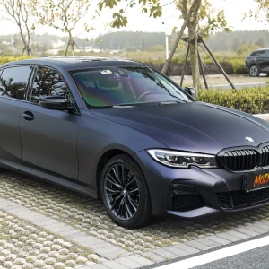 Side front exterior shot BMW 3 Series with MOZX Matte Midnight Purple matte TPU wrap, natural outdoor matte purple effect