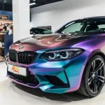Front side detail BMW M2 Fairy Spirit Blue wrap grille wheel close shot
