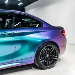 Full side profile BMW M2 Fairy Spirit Blue color shift PPF wrap rear wheel view