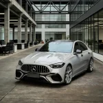 Mercedes C-Class AMG wrapped with MOZX Smart Nardo Grey high gloss PET vinyl wrap, industrial office full exterior showcase