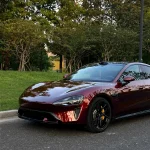 Angled front‑end shot Xiaomi sedan MOZX Smart metallic rose black PET car wrap