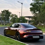 Rear‑three‑quarter view Xiaomi sports car MOZX Smart metallic rose black PET car wrap