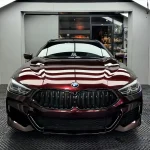 BMW straight‑on front view MOZX Elite metallic rose black TPU car wrap