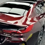 BMW taillight close‑up MOZX Elite metallic rose black TPU car wrap
