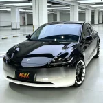 Tesla Model 3 with silver-black gradient vinyl wrap, glossy finish, front side view