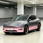 Tesla Model Y matte gray-pink gradient wrap, satin finish, parking garage