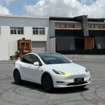 Angled front view Tesla Model Y MOZX Smart white iridescent gold PET wrap