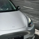 Wet hood detail Tesla with MOZX Smart GT Silver PET Vinyl Wrap, water droplet texture