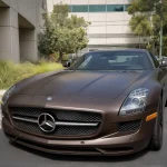 Close-up front hood Mercedes SLS AMG MOZX Easy Dark Copper matte PET wrap, fine silky matte metal texture macro shot