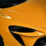 Close-up hood & headlight detail McLaren wrapped MOZX Elite McLaren Orange TPU wrap, smooth zero orange peel glossy surface