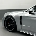 Detail shot MOZX Elite GT Silver TPU wrap on Porsche Panamera fender and wheel