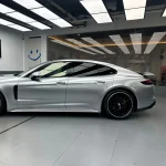 Side view Porsche Panamera with MOZX Elite GT Silver self-healing TPU wrap