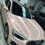 Top-down overhead view Audi A5 Sportback wrapped MOZX Smart Shell Pink PET wrap, full hood mirror light reflection display