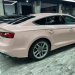 Rear side profile Audi A5 Sportback wrapped MOZX Smart Shell Pink PET vinyl wrap, clean trunk and rear fender wrapping craft