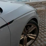 Wheel arch, bronze multi-spoke alloy wheel close-up Audi RS5 wrapped MOZX Elite Bernina Grey PET-TPU paint protection wrap