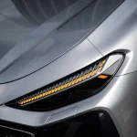 Headlight fender close-up with MOZX Smart GT Silver PET Vinyl Wrap, smooth metallic silver texture