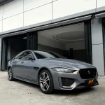 Jaguar XE fully wrapped with MOZX Easy Bernina Grey high gloss PET color change wrap, smooth glossy metallic grey finish
