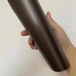 Hand hold raw film sample MOZX Easy Dark Copper matte metallic PET vinyl wrap, original dark copper texture without outdoor light interference