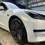 Fender close‑up Tesla MOZX Elite white iridescent gold TPU car wrap