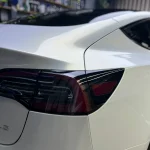 Rear taillight detail MOZX Elite white iridescent gold TPU car wrap Tesla