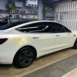 Side full‑body Tesla Model3 MOZX Elite white iridescent gold TPU car wrap