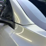 A‑pillar corner close‑up MOZX Elite white iridescent gold TPU car wrap