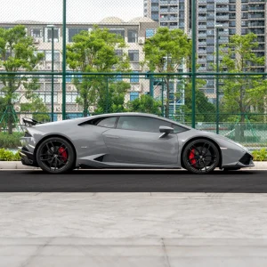 Full side profile Lamborghini Huracan wrapped MOZX Elite Nardo Grey TPU PET wrap, consistent mirror gloss finish across entire supercar body